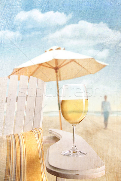 Stock photo: Glass of  wine on adirondack chair at the beach