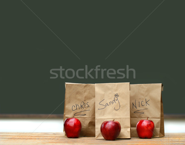 Lunch bags on desk with red apples Stock photo © Sandralise