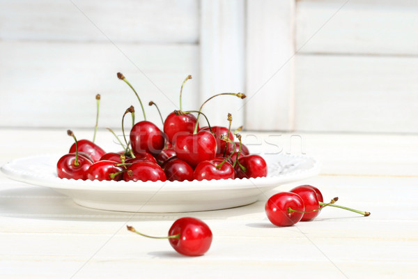 Cherries on a white plate Stock photo © Sandralise
