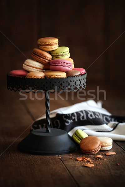 Cake stand with macaroons on dark wood background Stock photo © Sandralise
