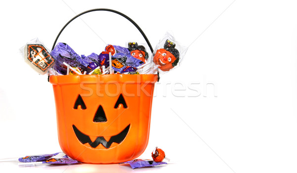 Jack-o-Lantern bucket filled with candies Stock photo © Sandralise