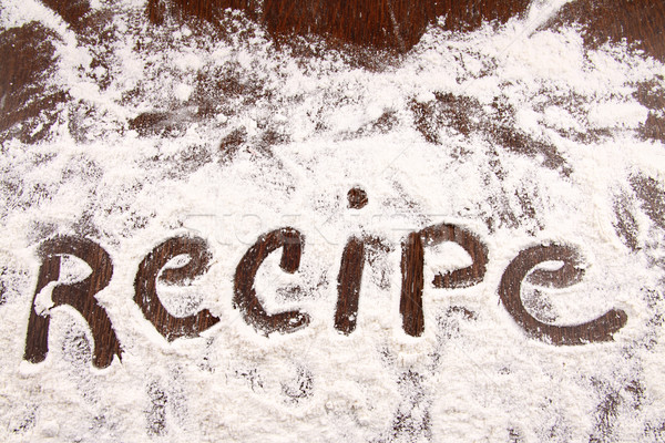 Word recipe written in white flour on  wooden table Stock photo © Sandralise
