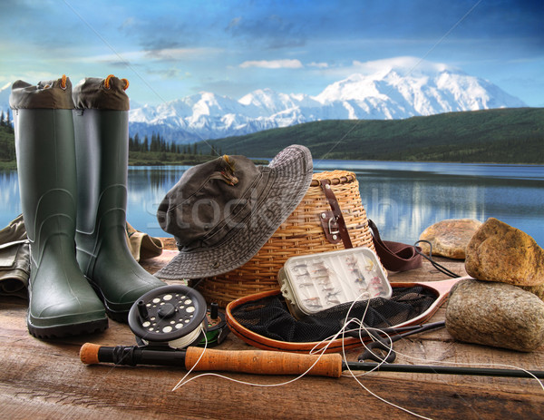 Fly fishing equipment on deck with view of a lake and mountains Stock photo © Sandralise