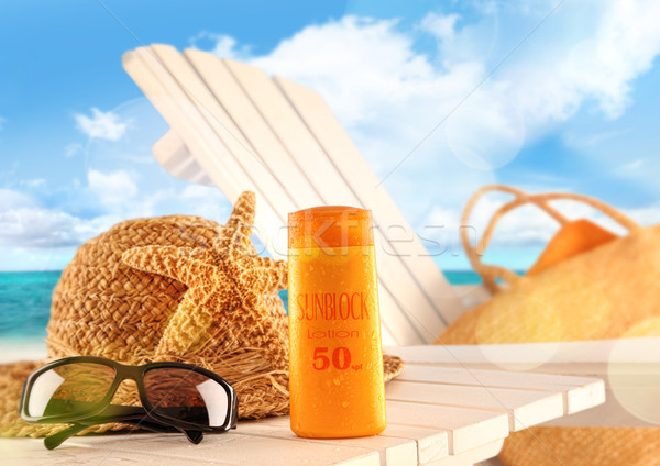 Sunblock lotion and beach items on table  Stock photo © Sandralise