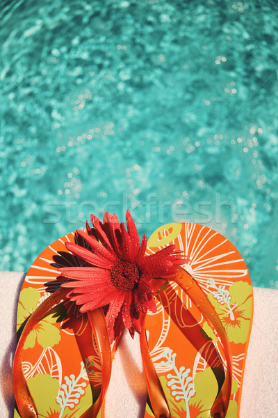 Stock photo: Flip Flops on white towel pool 