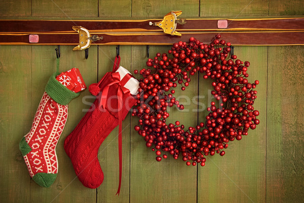 Christmas stockings and wreath hanging on  wall Stock photo © Sandralise