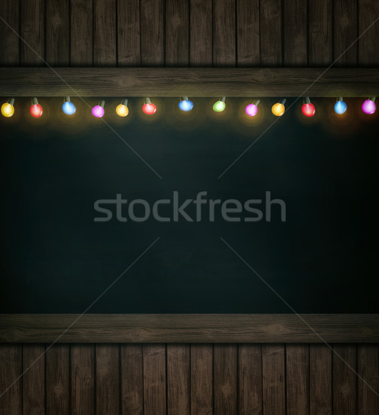 Christmas lights on wooden blackboard Stock photo © Sandralise