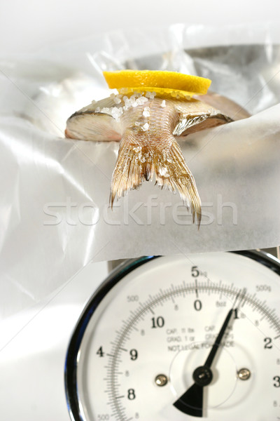 Fish with lemon slice on weight scale Stock photo © Sandralise