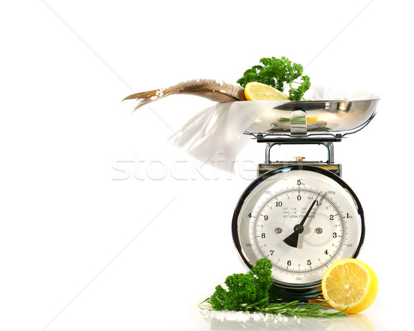Weight scale, fish,lemon on parchment paper  Stock photo © Sandralise