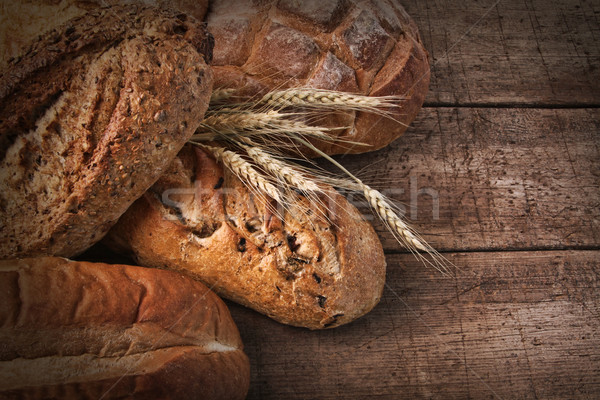 Assortment of loaves of bread on wood Stock photo © Sandralise