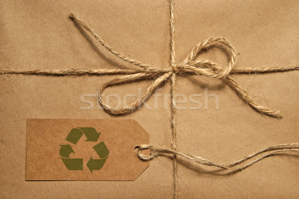 Brown shipping parcel tied with twine and tag for copy space Stock photo © Sandralise