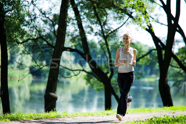 Nő fut fiatal nő néz egyenes nyár Stock fotó © sapegina