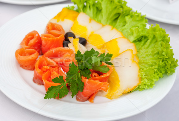 Stock photo: assorted fish slices with salad