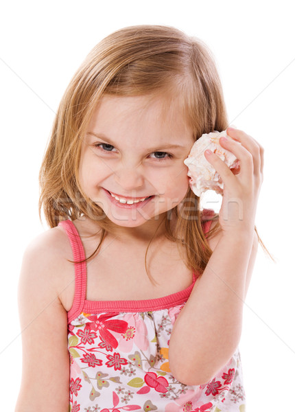 Little girl alegre escuta concha isolado branco Foto stock © sapegina