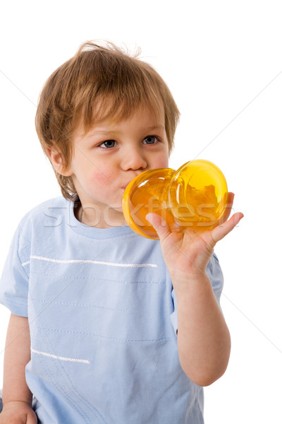 Szomjas fiú iszik dzsúz izolált fehér Stock fotó © sapegina