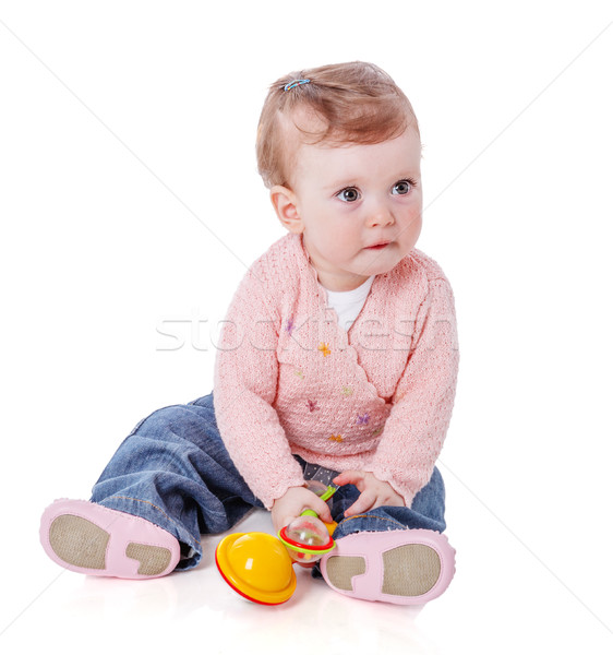 Stock photo: Girl playing rattle
