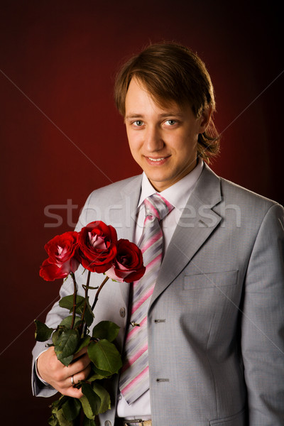 Człowiek kwiaty młody człowiek garnitur Zdjęcia stock © sapegina