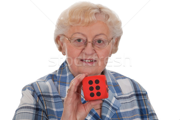 Senior woman with dice Stock photo © Saphira