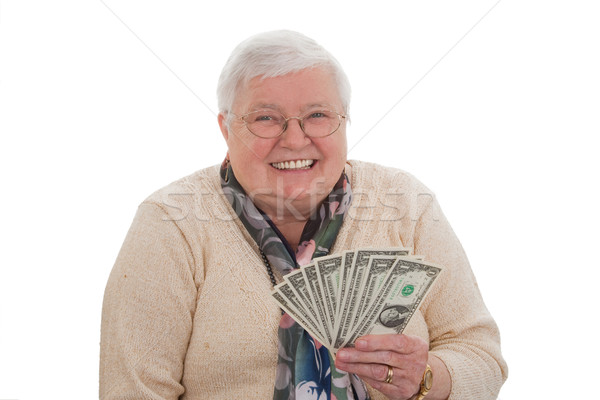 Stock photo: Senior woman with dollars - horizontal format