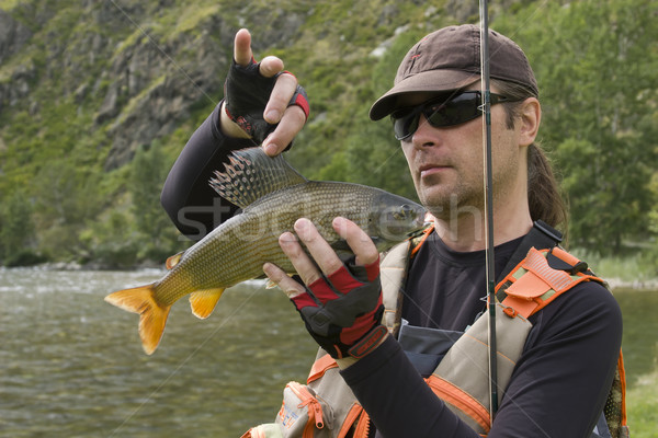 Fischer halten groß Männer Fluss Stock foto © Saracin