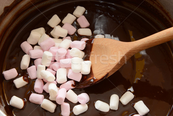 Stirring mini marshmallows into melted chocolate Stock photo © sarahdoow