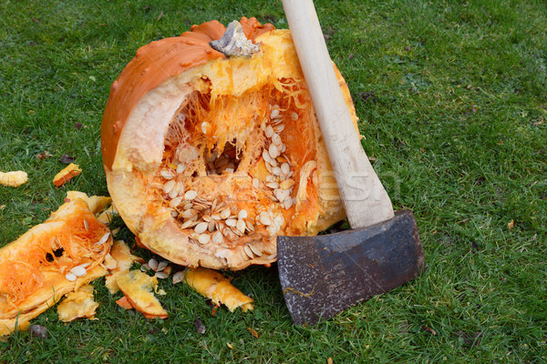 Long-handled axe against a warty orange pumpkin Stock photo © sarahdoow