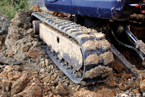 Digger's tracks on rubble, soil and brick Stock photo © sarahdoow