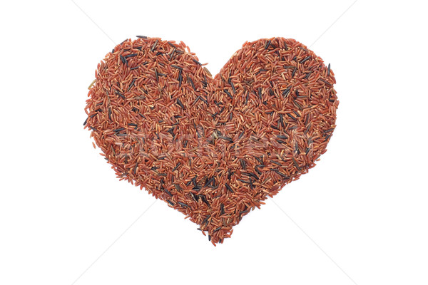Red camargue rice in a heart shape Stock photo © sarahdoow