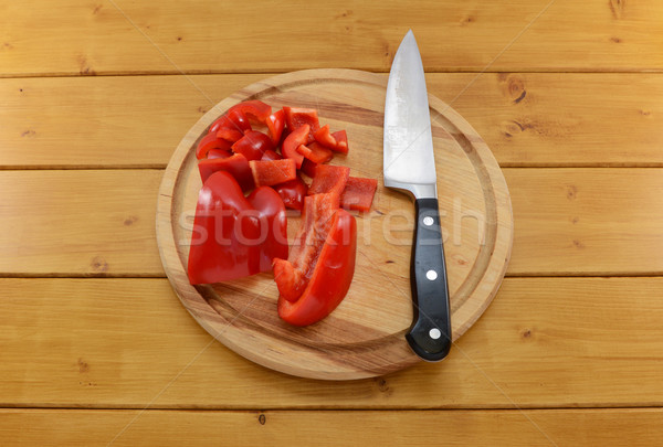 Red pepper sliced with knife on a chopping board Stock photo © sarahdoow