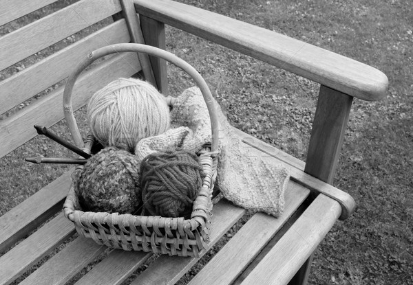 Basket of knitting and yarns on a bench Stock photo © sarahdoow
