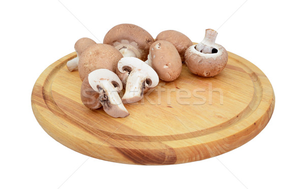 Chestnut mushrooms, whole and halved on a wooden board Stock photo © sarahdoow