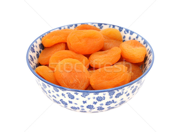 Dried apricots in a blue and white china bowl Stock photo © sarahdoow