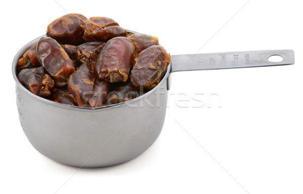 Sticky whole dates in an American cup measure Stock photo © sarahdoow
