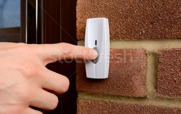 Primer plano mujer timbre de la puerta botón pared de ladrillo Foto stock © sarahdoow