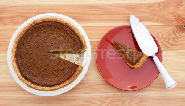 Slice taken from a pumpkin pie with pie server Stock photo © sarahdoow