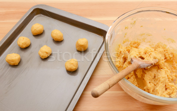 Balls of cookie dough on a baking sheet  Stock photo © sarahdoow
