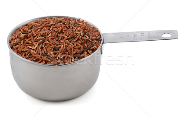 Camargue red rice grains in a cup measure Stock photo © sarahdoow