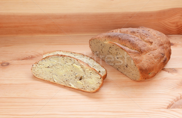 Buttered slice of bread with the remaining loaf  Stock photo © sarahdoow