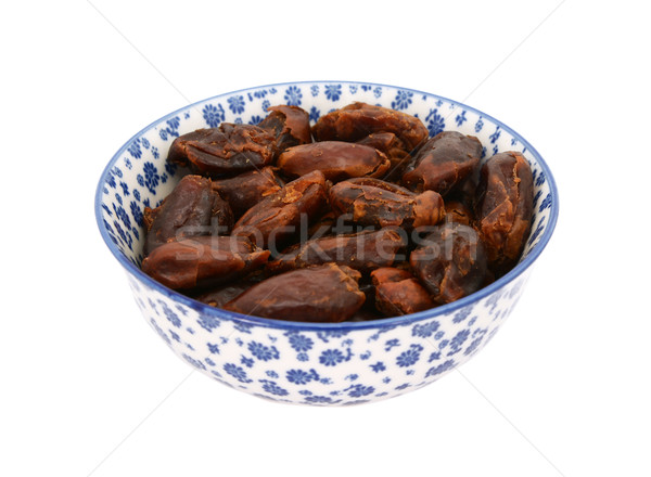 Whole dates in a blue and white china bowl Stock photo © sarahdoow