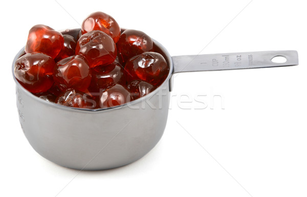 Sticky whole glace cherries in a cup measure Stock photo © sarahdoow