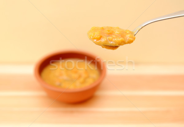 Stock photo: Spoonful of vegetable soup above the bowl