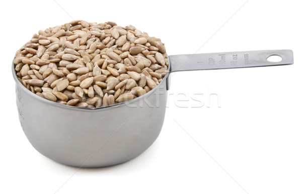 Hulled sunflower seeds in a cup measure Stock photo © sarahdoow