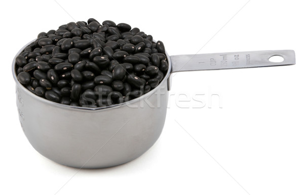 Black turtle beans in a cup measure Stock photo © sarahdoow