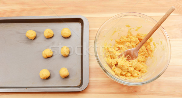 Adding balls of cookie dough to a baking sheet Stock photo © sarahdoow