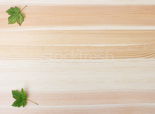 Two green sycamore leaves on a wood background Stock photo © sarahdoow
