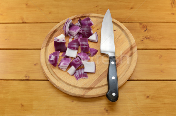 Chopped red onion with a knife on a chopping board Stock photo © sarahdoow