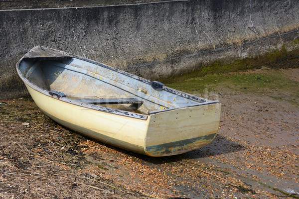 Weather-beaten dinghy on a concrete slipway Stock photo © sarahdoow