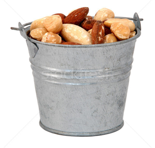 Stock photo: Mixed nuts in a miniature metal bucket