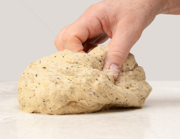 Woman's hand kneading bread dough Stock photo © sarahdoow