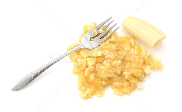 Ripe banana being mashed with a fork Stock photo © sarahdoow
